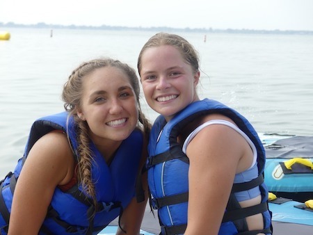 two youth in safety vests