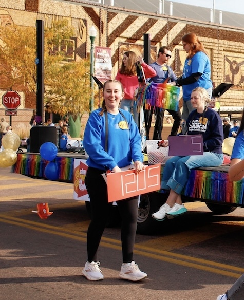 Anna with students on homecoming parade float